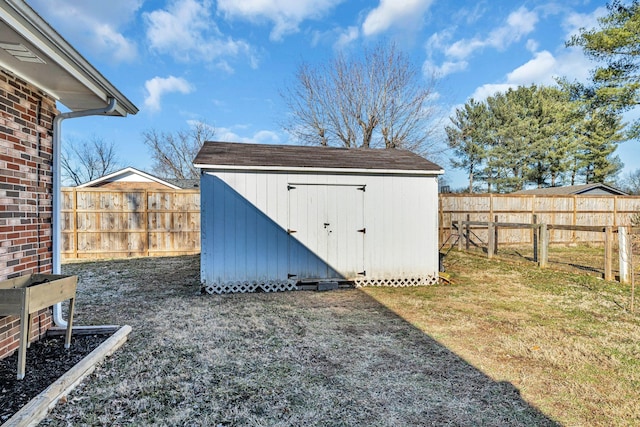 view of shed with a fenced backyard