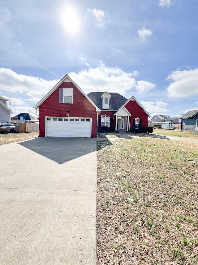 view of front of house featuring concrete driveway, brick siding, and fence