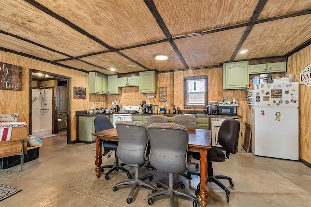 interior space with concrete floors, wooden ceiling, wood walls, and a sink