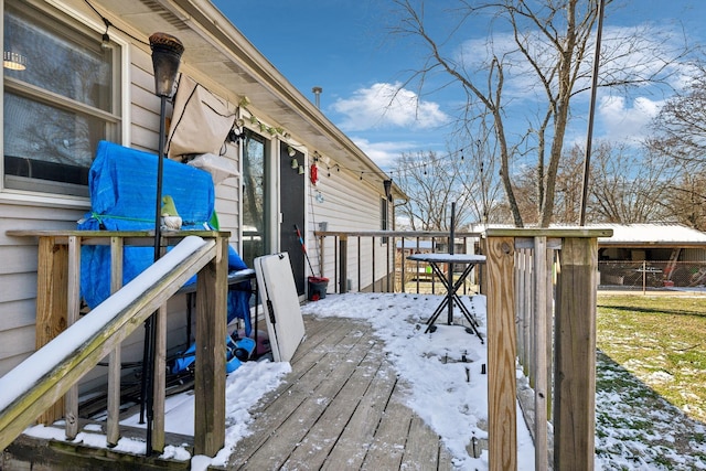 view of snow covered deck