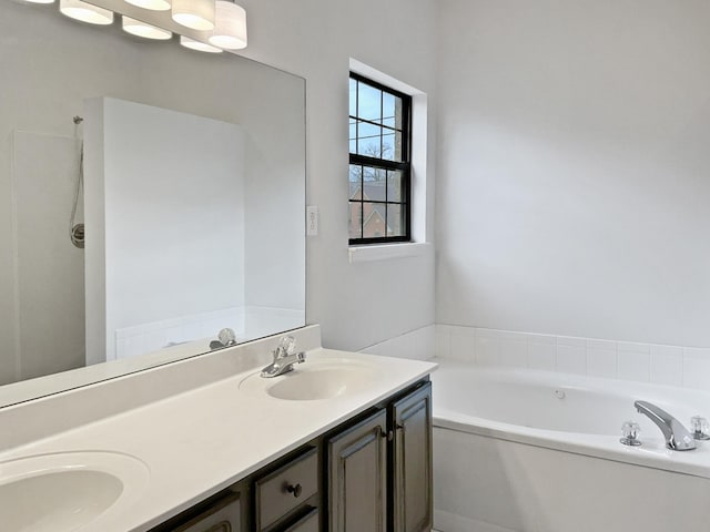 full bathroom with a bath, double vanity, and a sink