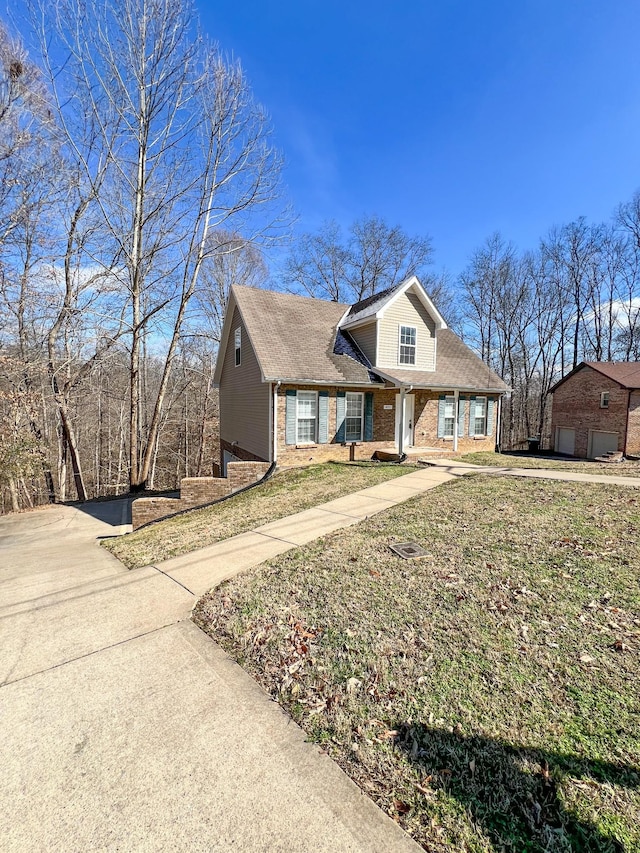 view of front of house featuring a garage and brick siding