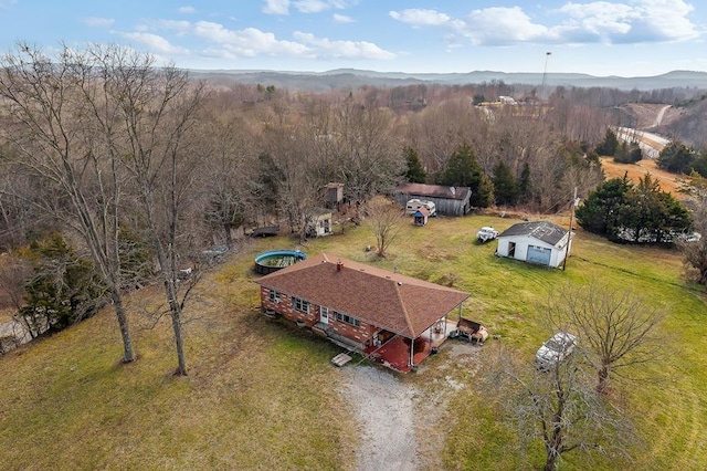 birds eye view of property with a mountain view