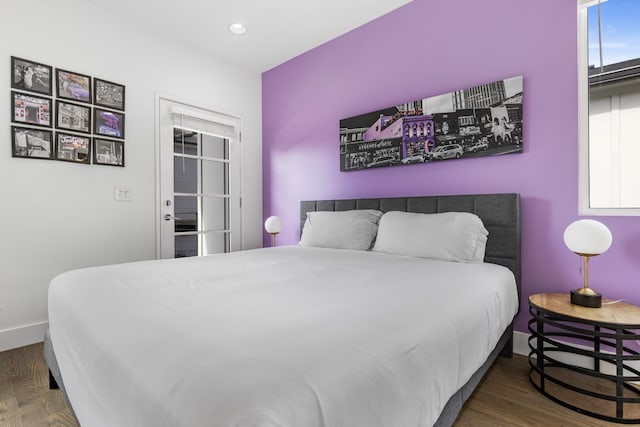 bedroom with baseboards, dark wood-style flooring, and recessed lighting