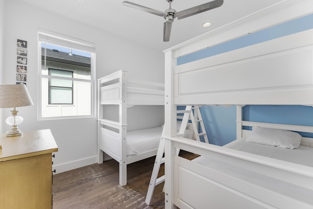 bedroom featuring dark wood-style floors, ceiling fan, and baseboards