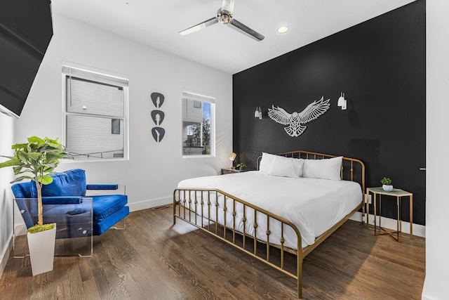 bedroom featuring dark wood-type flooring, recessed lighting, ceiling fan, and baseboards