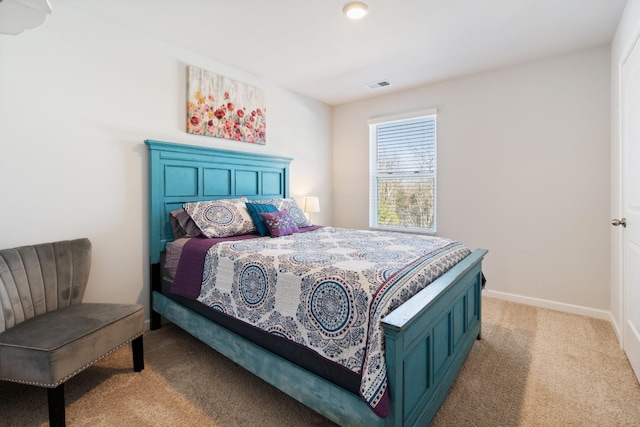 bedroom featuring light carpet, baseboards, and visible vents