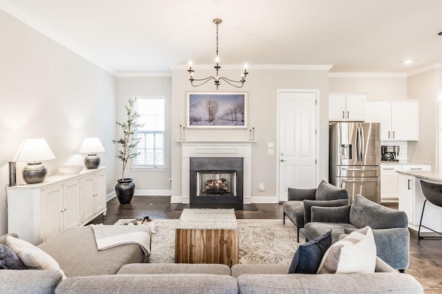 living room with ornamental molding, a premium fireplace, and baseboards