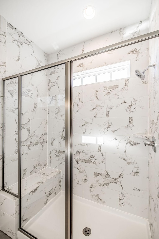 bathroom featuring a shower stall