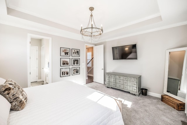 bedroom with a tray ceiling, light carpet, and a notable chandelier