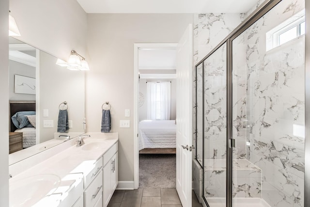 ensuite bathroom with a sink, connected bathroom, and a marble finish shower