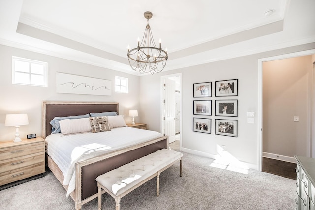 bedroom with a chandelier, ornamental molding, a raised ceiling, and baseboards