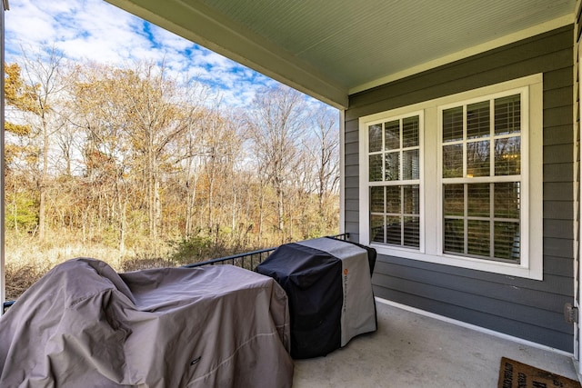 view of patio / terrace with a grill and a balcony