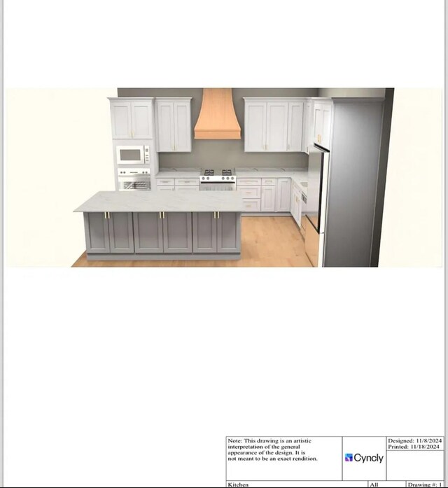 kitchen with gray cabinetry, custom exhaust hood, range, and a center island