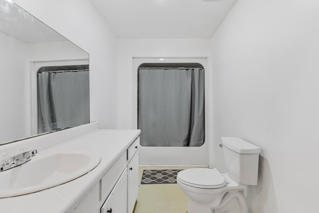 full bath featuring vanity, toilet, and tile patterned floors