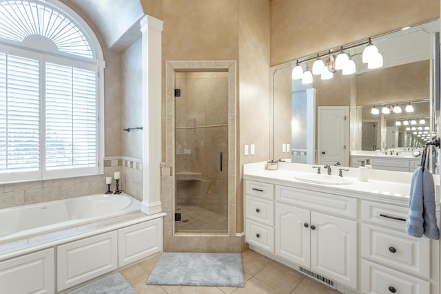 bathroom featuring visible vents, tile patterned floors, a garden tub, vanity, and a shower stall