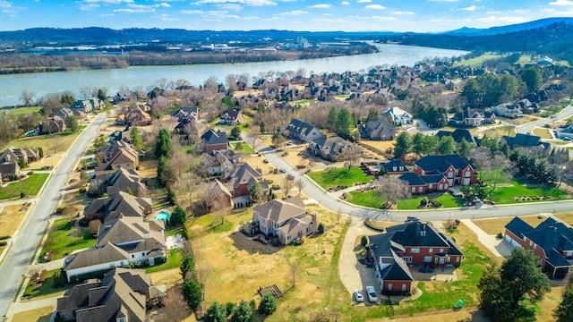 bird's eye view featuring a residential view and a water and mountain view