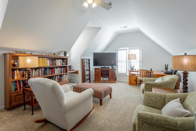 sitting room with lofted ceiling, carpet floors, ceiling fan, and visible vents