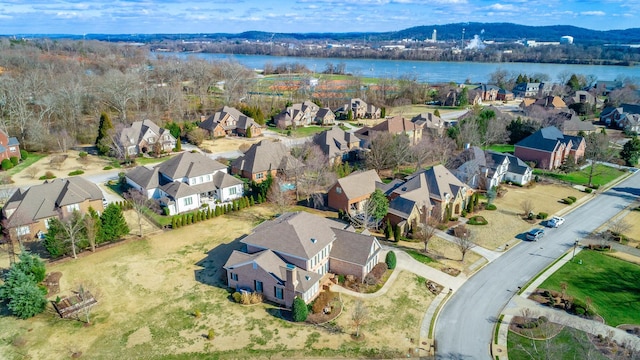 bird's eye view featuring a residential view and a water and mountain view