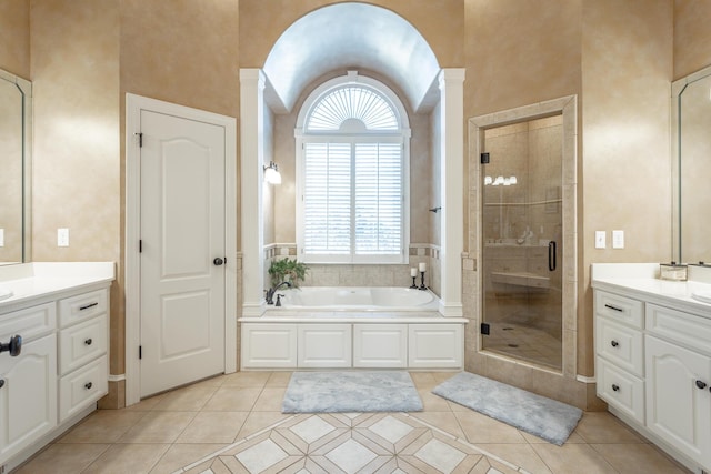 full bathroom with tile patterned flooring, vanity, a bath, and a shower stall