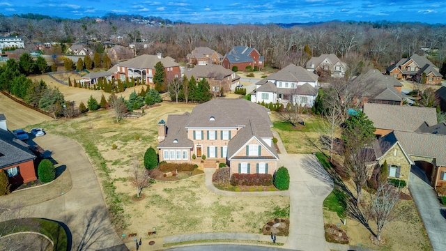 birds eye view of property with a residential view