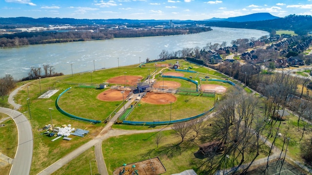 aerial view featuring a water and mountain view