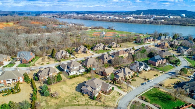 bird's eye view featuring a residential view and a water view