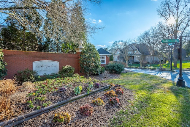 exterior space featuring a residential view and a lawn