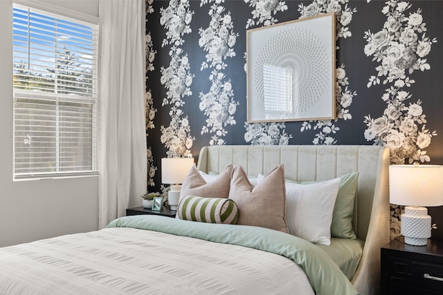 bedroom with wallpapered walls