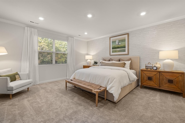 bedroom with recessed lighting, light colored carpet, visible vents, baseboards, and crown molding