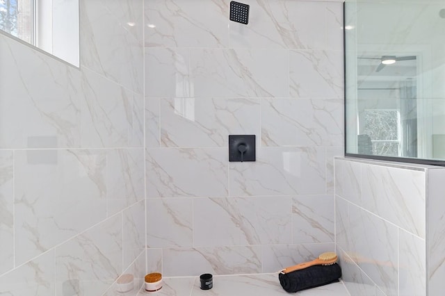 bathroom with tiled shower