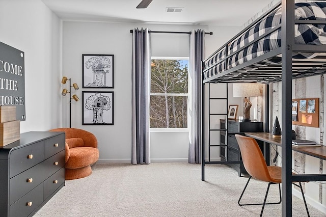 carpeted bedroom with visible vents and baseboards