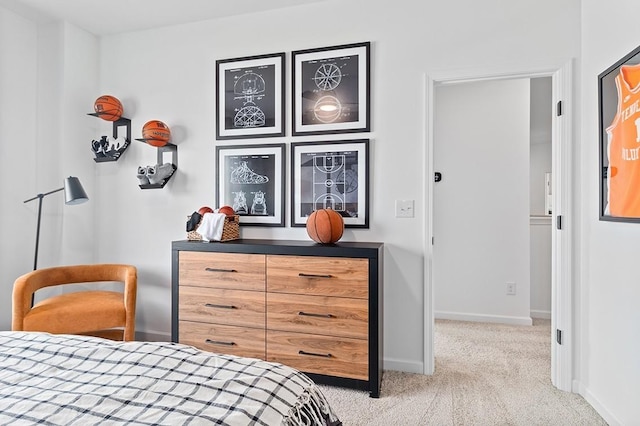 bedroom with baseboards and carpet floors