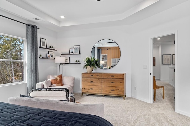 bedroom with a raised ceiling, recessed lighting, carpet, and baseboards