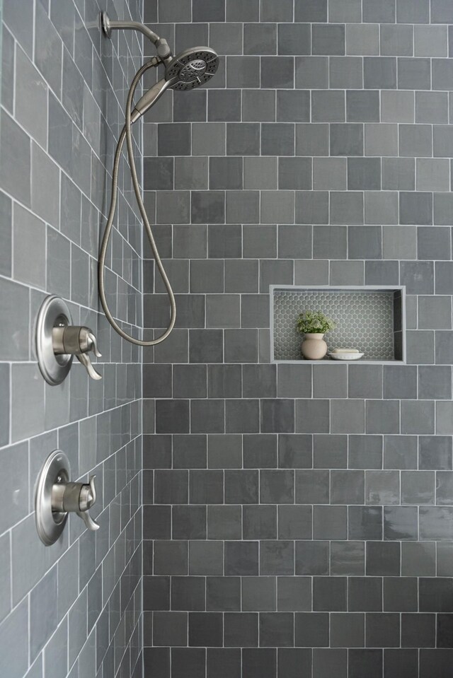 bathroom with tiled shower