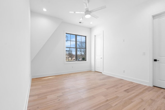 spare room with light wood finished floors, recessed lighting, visible vents, ceiling fan, and baseboards