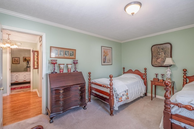 bedroom featuring ornamental molding, light carpet, baseboards, and an inviting chandelier