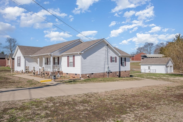 view of side of home featuring a shingled roof, crawl space, a yard, an outdoor structure, and a porch