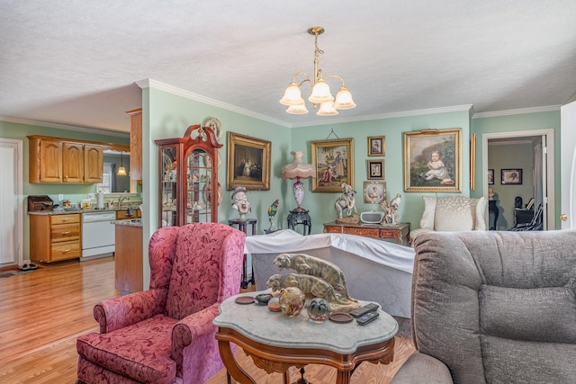 living area with a chandelier, light wood-type flooring, and crown molding