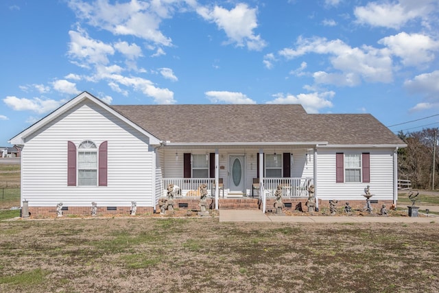 ranch-style house with a shingled roof, a front yard, crawl space, and covered porch