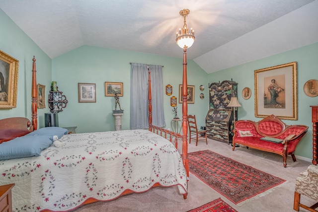 bedroom with carpet flooring, vaulted ceiling, and a notable chandelier