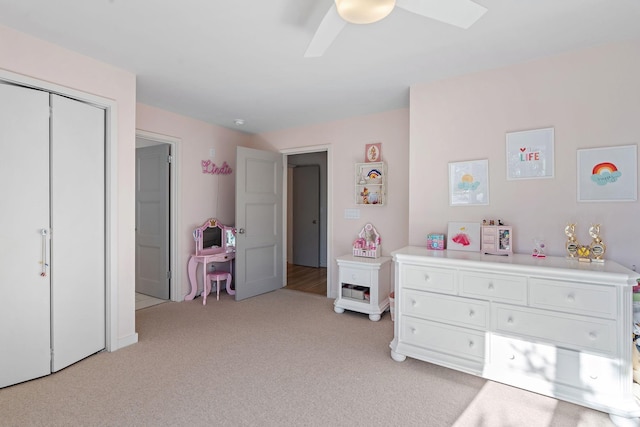 bedroom featuring light carpet and ceiling fan