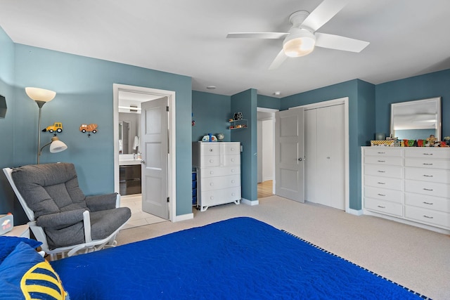 bedroom featuring a closet, light carpet, ceiling fan, and baseboards