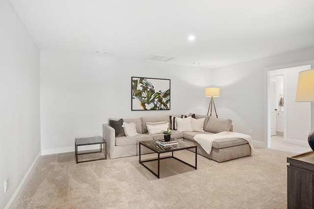 carpeted living room featuring recessed lighting and baseboards