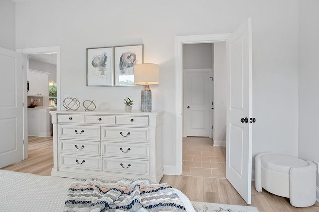 bedroom with light wood finished floors