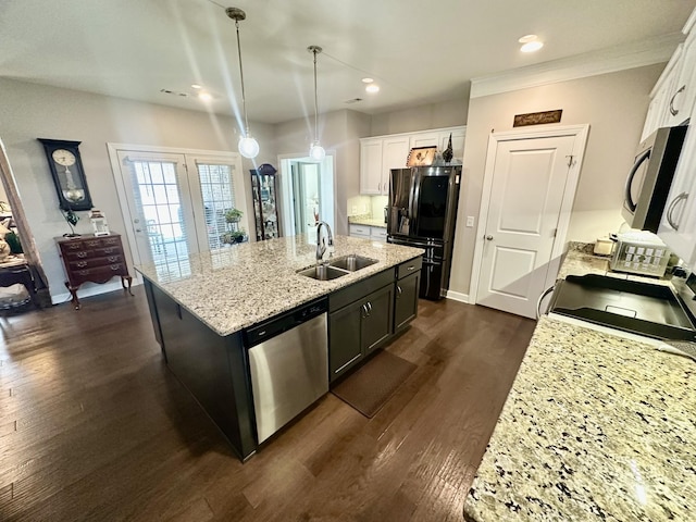 kitchen featuring dishwasher, black fridge with ice dispenser, dark wood-style flooring, a kitchen island with sink, and a sink