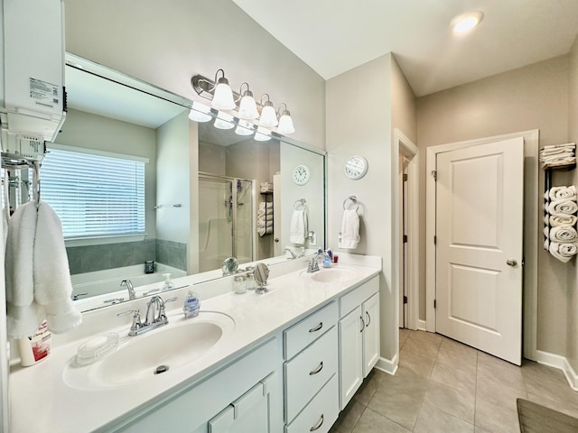 full bath featuring double vanity, tile patterned flooring, a sink, and a shower stall