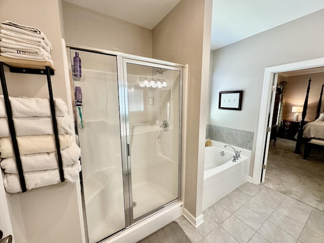 full bath with ensuite bathroom, tile patterned flooring, a shower stall, and a bath