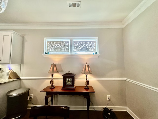 office with ornamental molding, visible vents, and baseboards