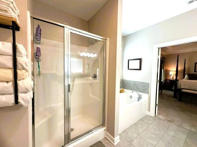 ensuite bathroom featuring a stall shower, visible vents, connected bathroom, a garden tub, and tile patterned flooring